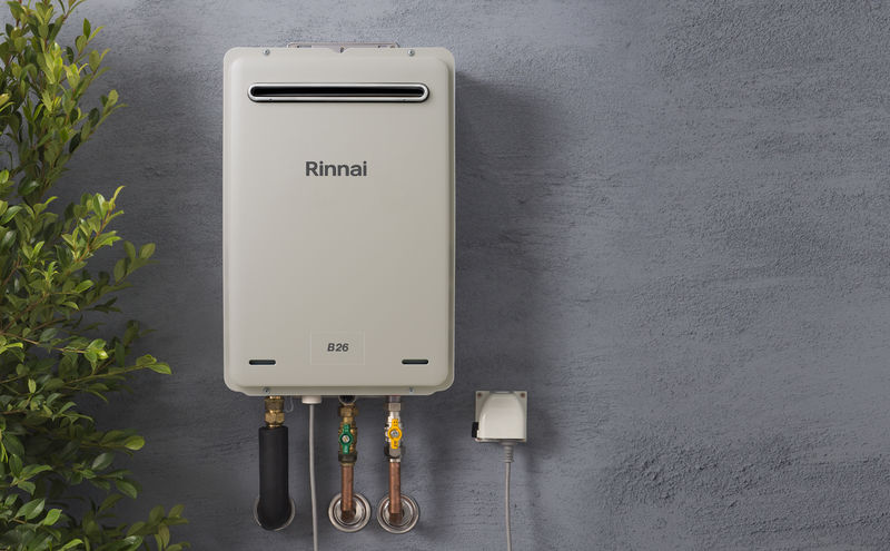 Rinnai continuous flow gas hot water unit on a home exterior wall