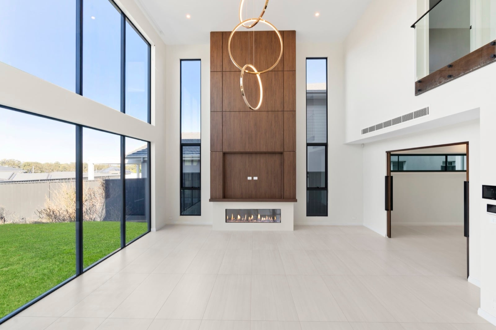 Ducted reverse-cycle air conditioning in a double-height living room, Western Sydney