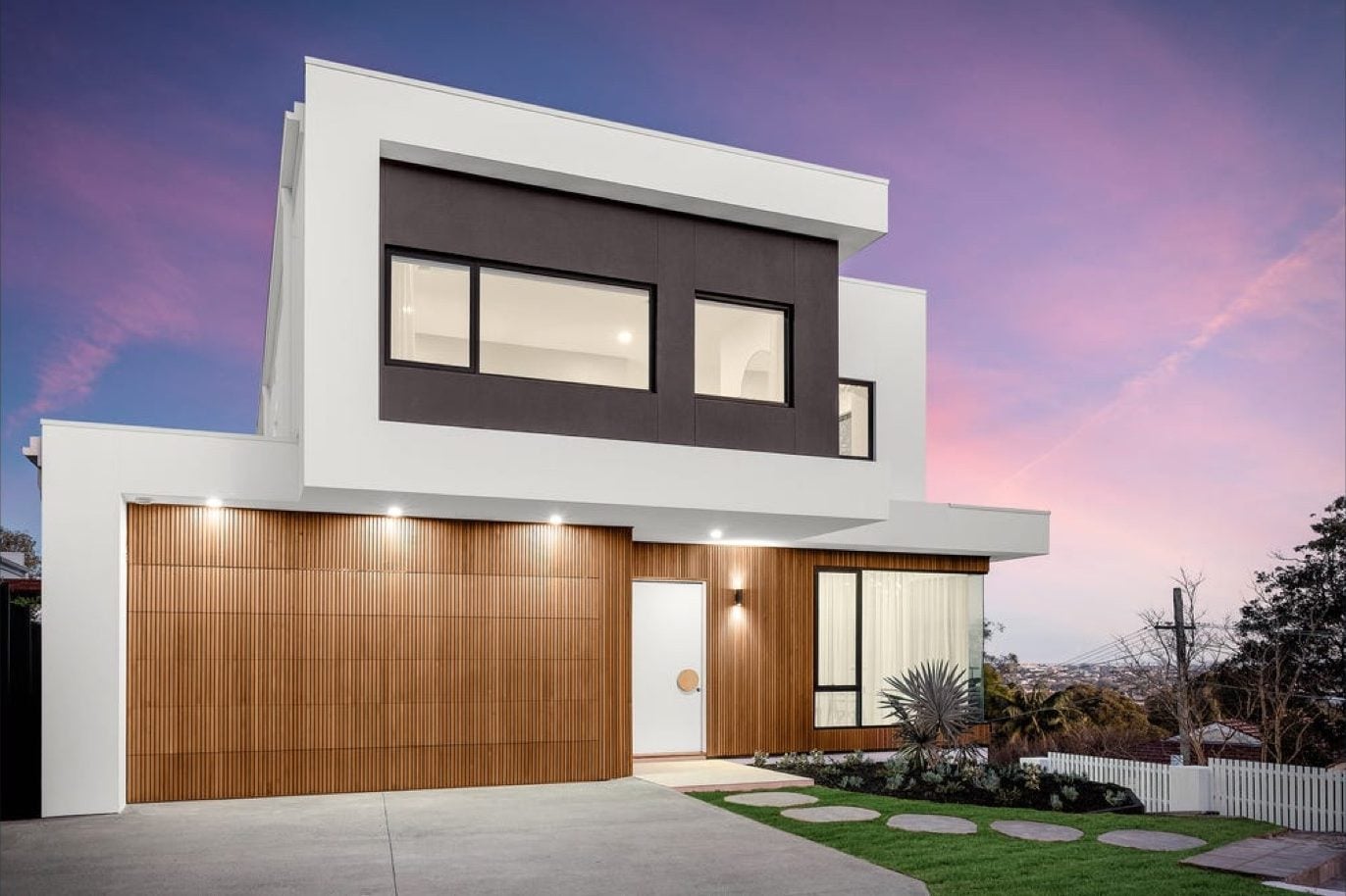 A custom home in Greenwich at dusk, heated and cooled by Ample Air