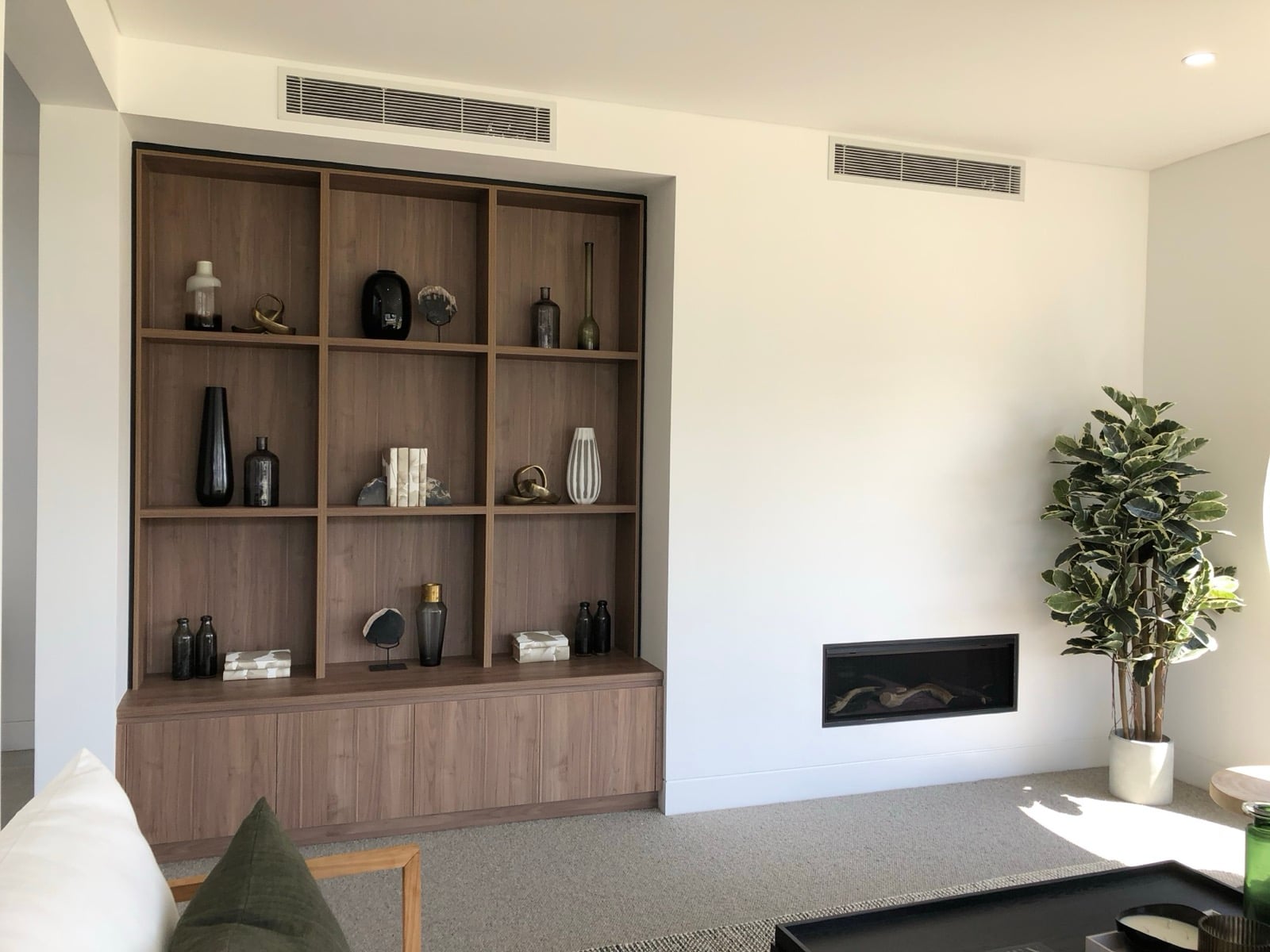 Living room with built-in gas fireplace and ducted air conditioning