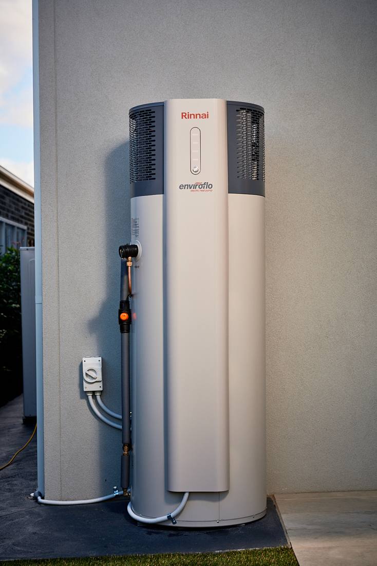 Rinnai Enviroflo heat pump hot water system installed outside a home